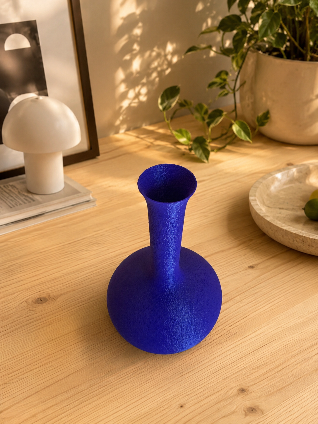 Modern Antica Caverna decorative vase displayed on a wooden table in a contemporary interior