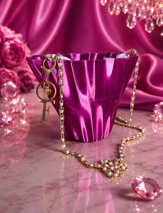 Aurora Fold modern geometric handbag in glossy magenta TPU with elegant pearl chain detail