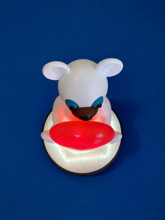 Top view of decorative bear lamp with illuminated red heart