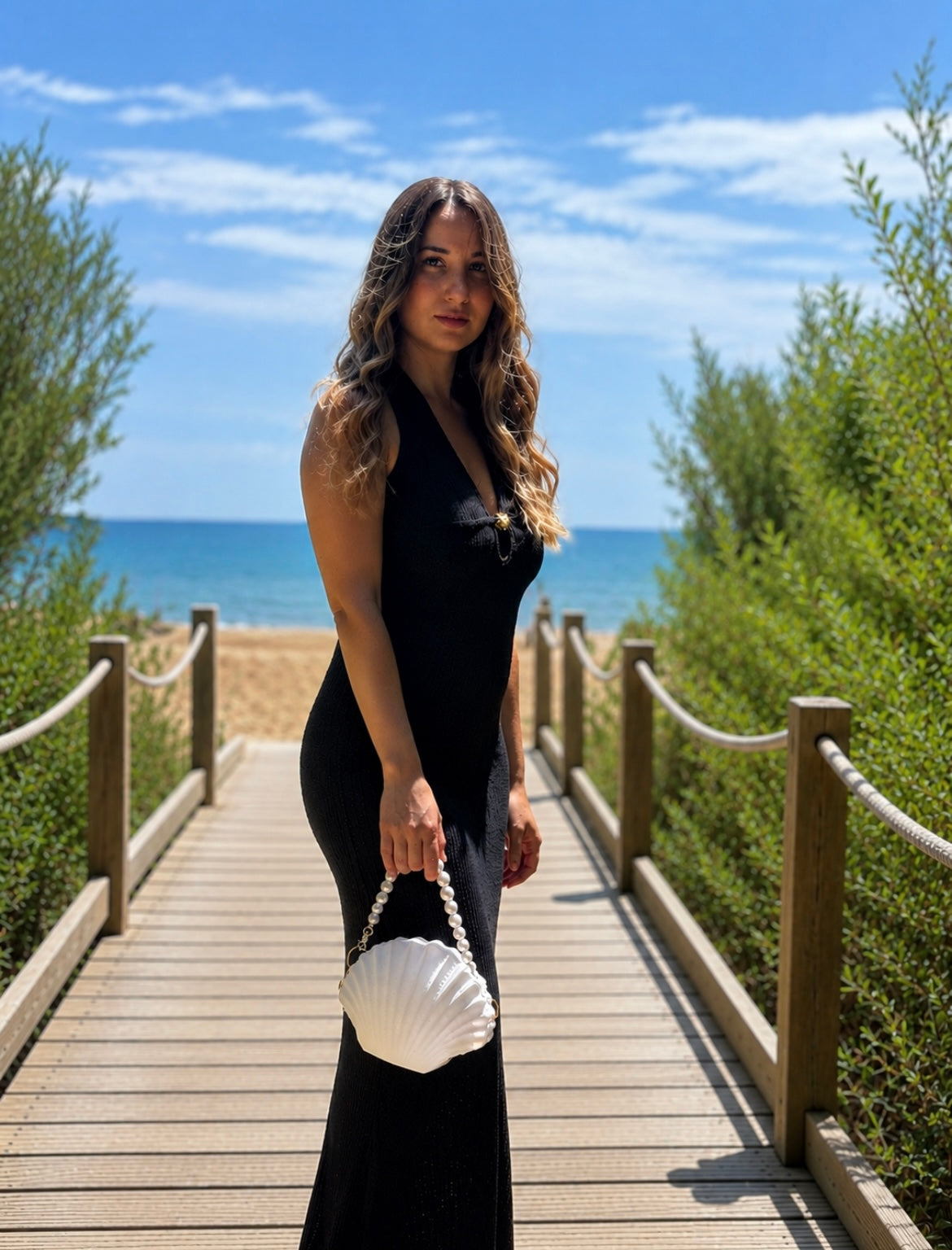 Luxury White Shell Bag with Pearl Handle Carried by Fashion Model, Designer Women's Handbag for Summer and Coastal Chic Outfits