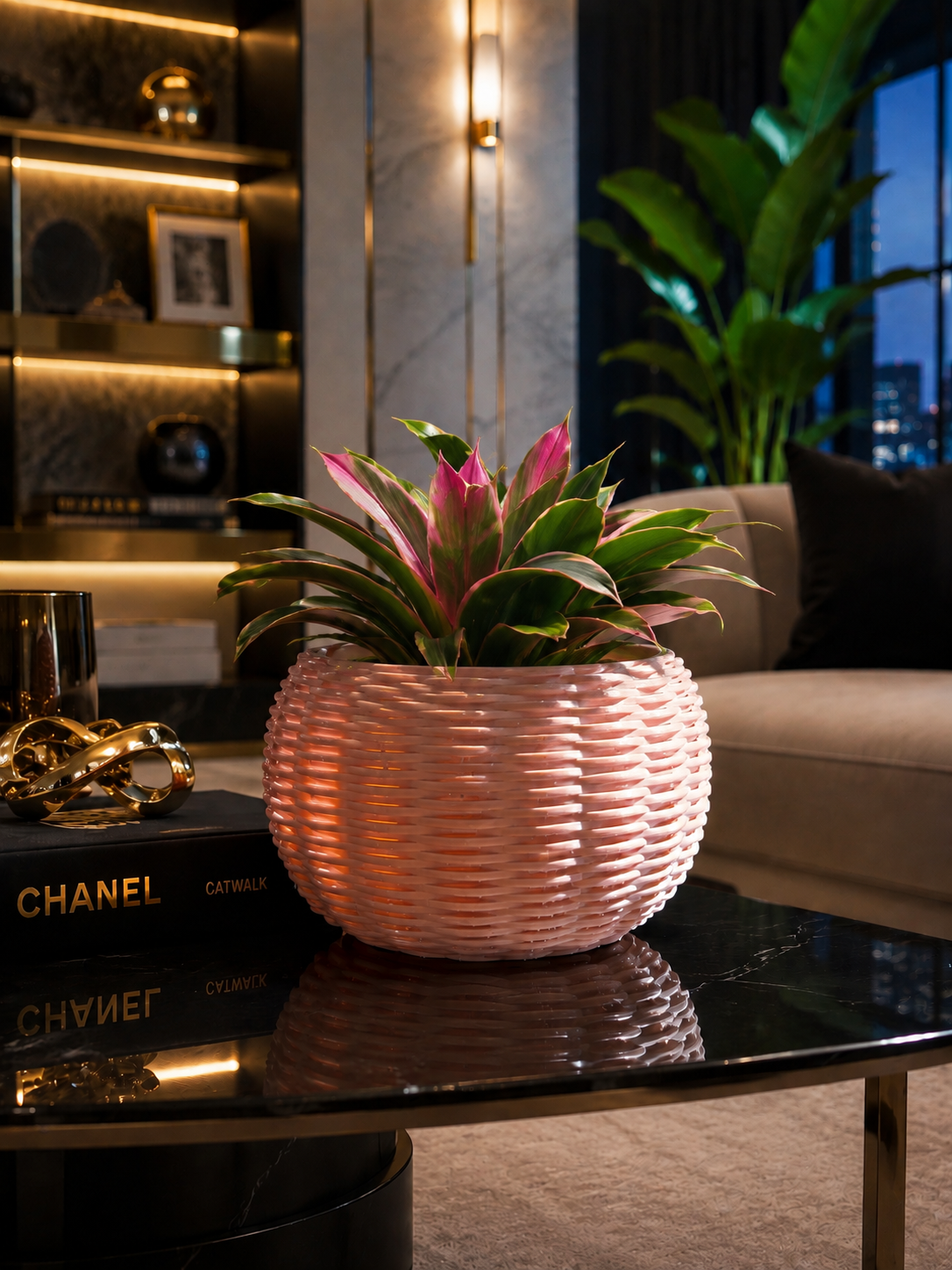 Elevate your interior with this elegant decorative planter, featuring a distinctive woven-look design and a sophisticated modern finish. Styled with a vibrant indoor plant, it creates an eye-catching accent for living rooms, offices, shelves and contemporary spaces.