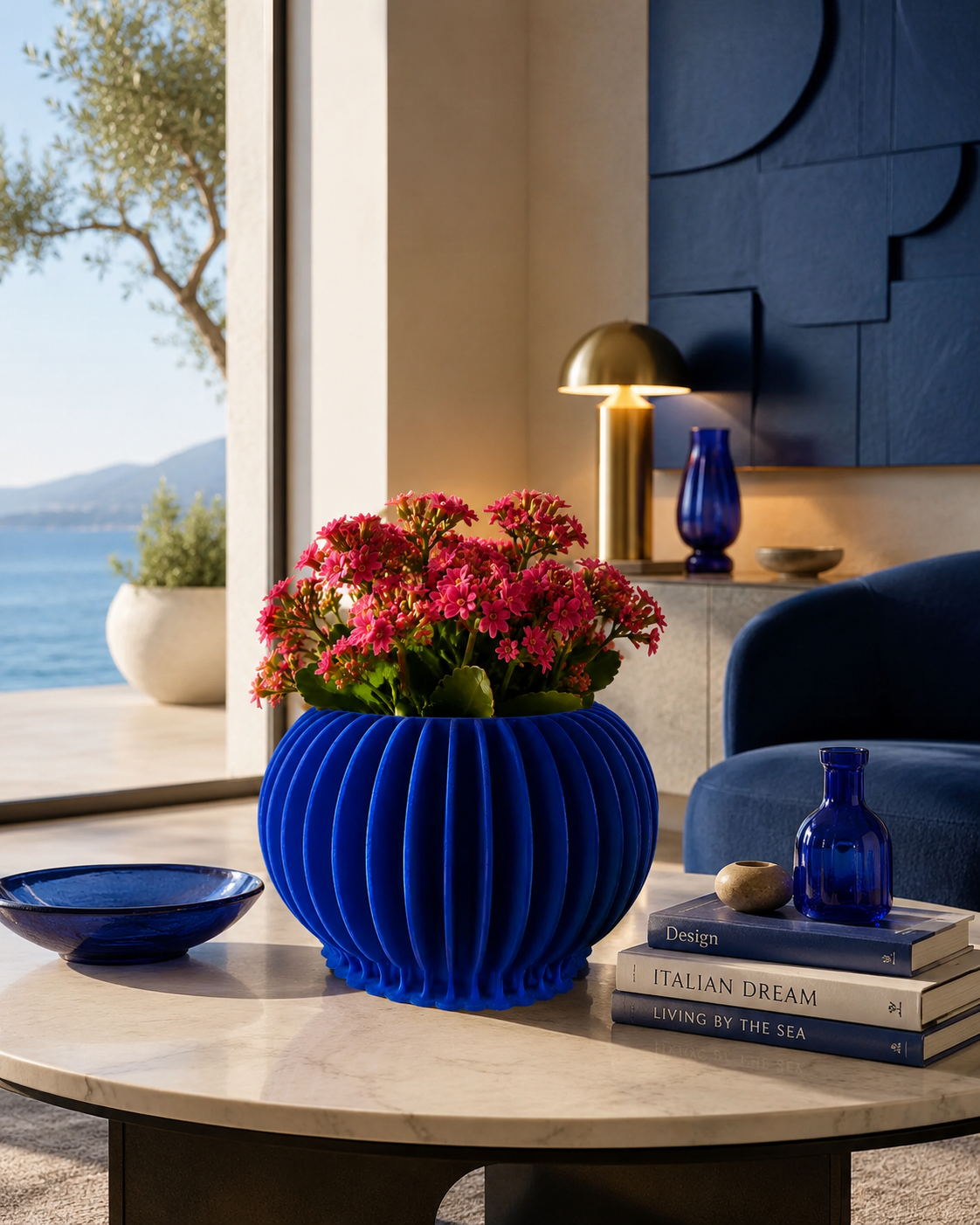 Luxury blue 3D printed planter vase with vibrant pink flowers displayed in a modern designer living room. Elegant Made in Italy home decor for indoor plants and contemporary interiors.