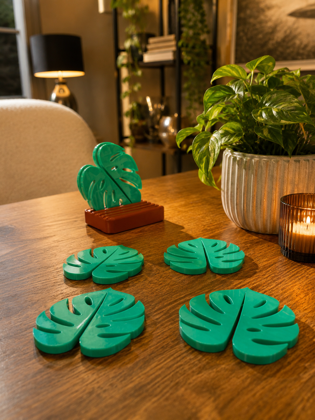 Elegant tropical leaf drink coasters inspired by Monstera plants. Decorative table accessories that protect surfaces while enhancing modern home interiors with a fresh botanical aesthetic.