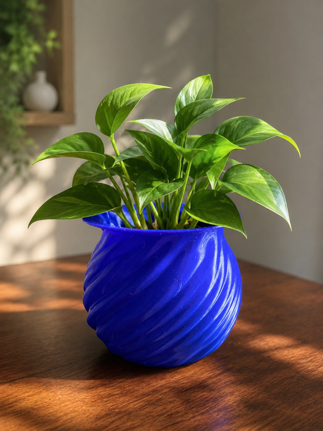 Elegant blue spiral planter with lush green indoor plant, modern 3D printed flower pot for home decor, living room decoration, office styling, contemporary planter, unique…