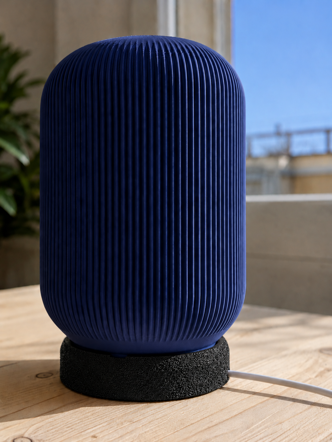 Modern 3D printed table lamp with a navy blue ribbed shade and textured black base, featuring a contemporary minimalist design for bedrooms, bedside tables, living rooms and modern home decor.