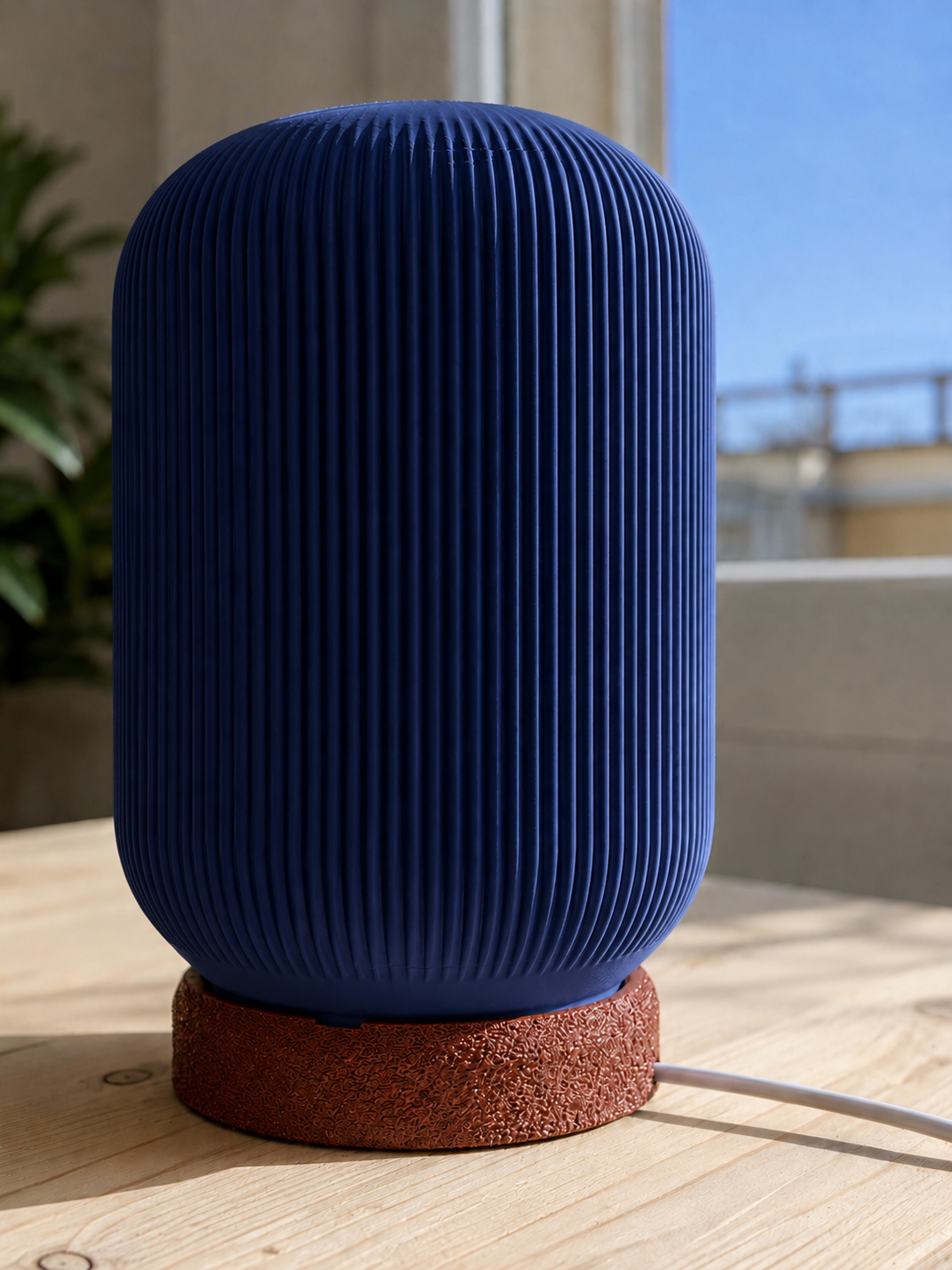 Modern 3D printed table lamp with a navy blue ribbed shade and textured brown base, featuring a contemporary minimalist design for bedrooms, bedside tables, living rooms and modern home decor.