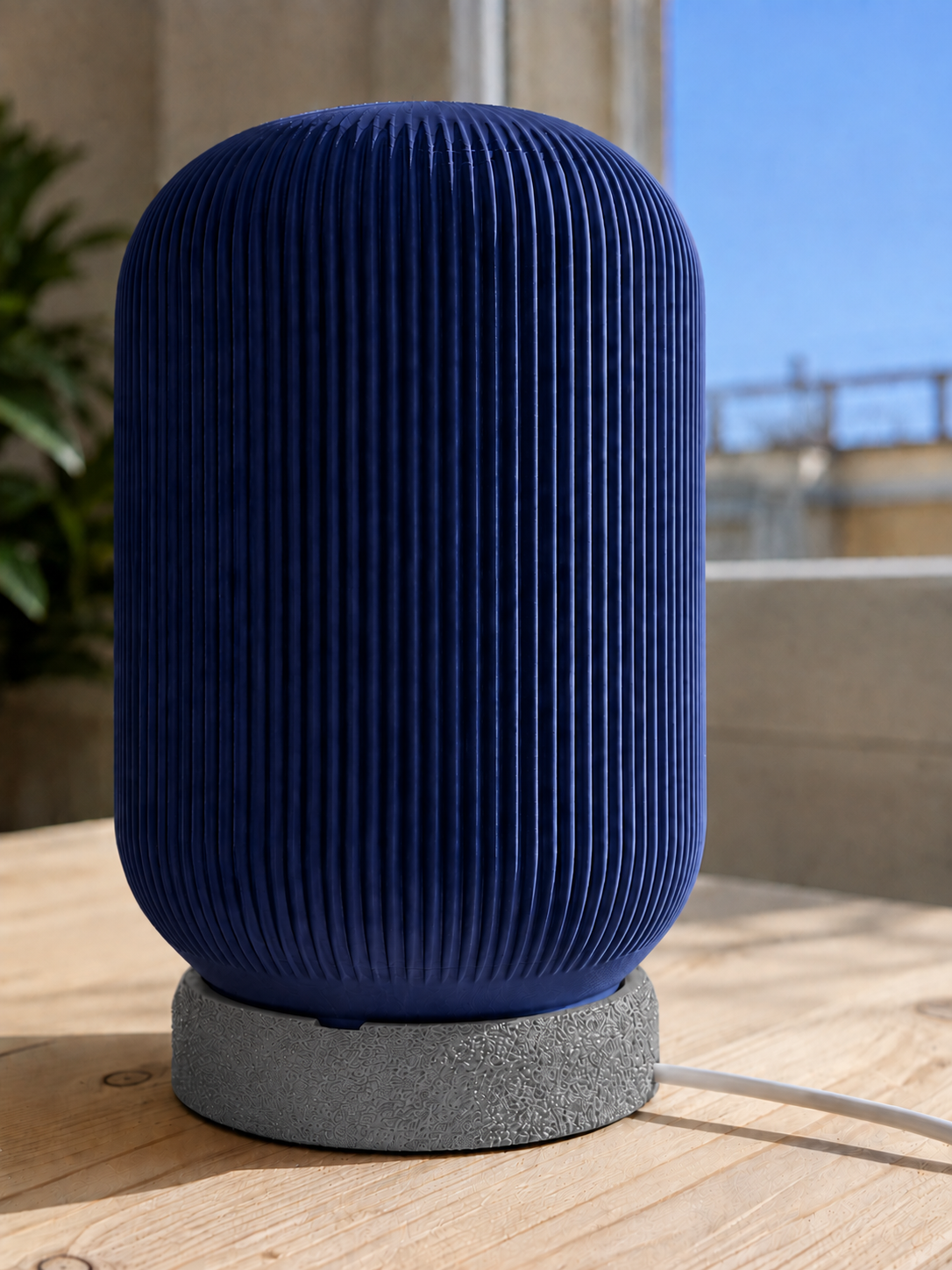 Modern 3D printed table lamp with a navy blue ribbed shade and textured grey base, featuring a contemporary minimalist design for bedrooms, bedside tables, living rooms and modern home decor.