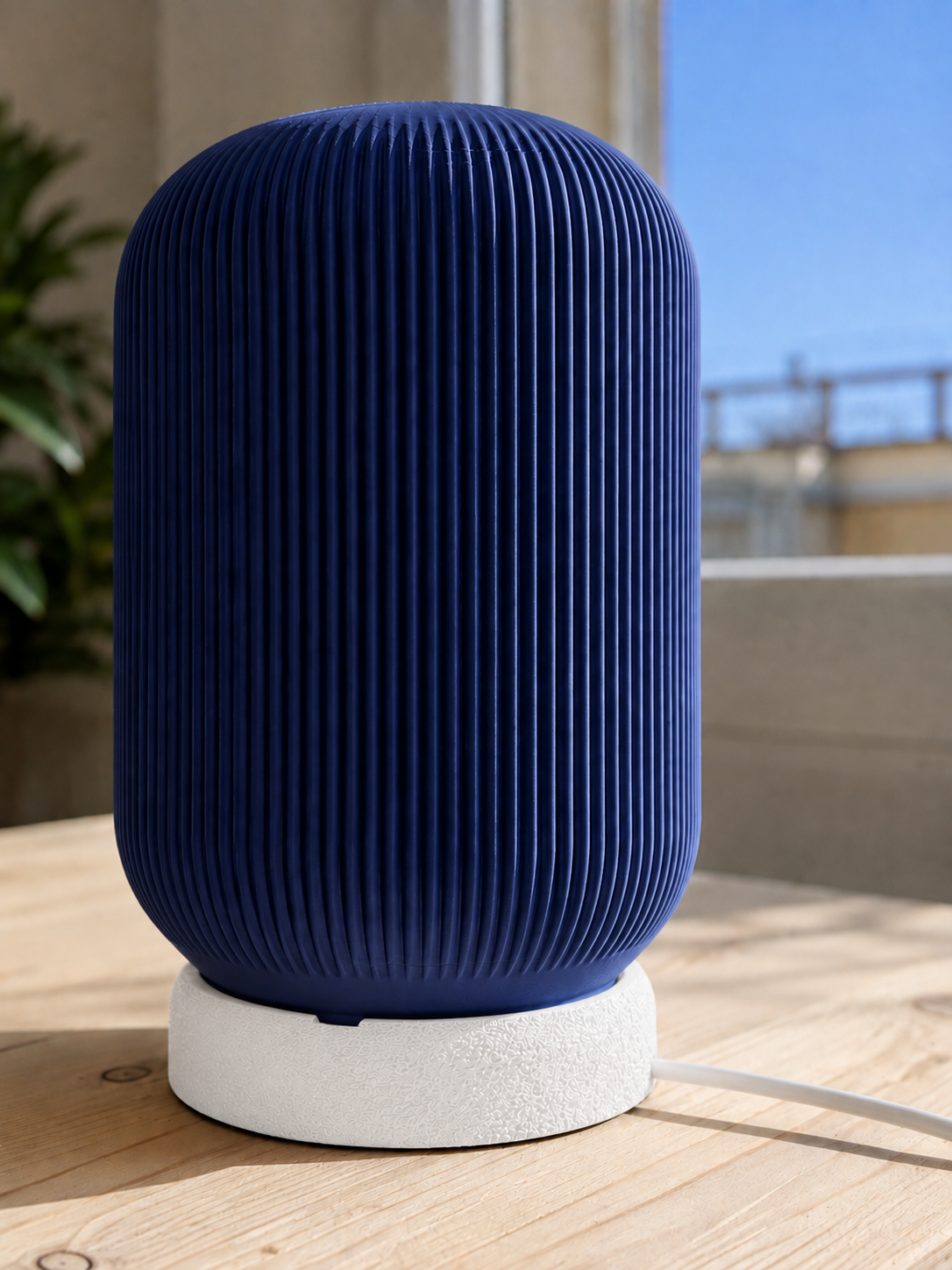 Modern 3D printed table lamp with a navy blue ribbed shade and textured white base, featuring a contemporary minimalist design for bedrooms, bedside tables, living rooms and modern home decor.