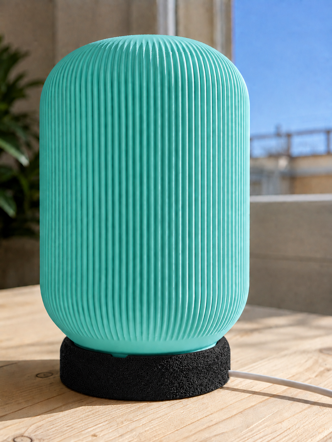Modern 3D printed table lamp with a turquoise ribbed shade and textured black base, featuring a contemporary minimalist design for bedrooms, bedside tables, living rooms and modern home decor.