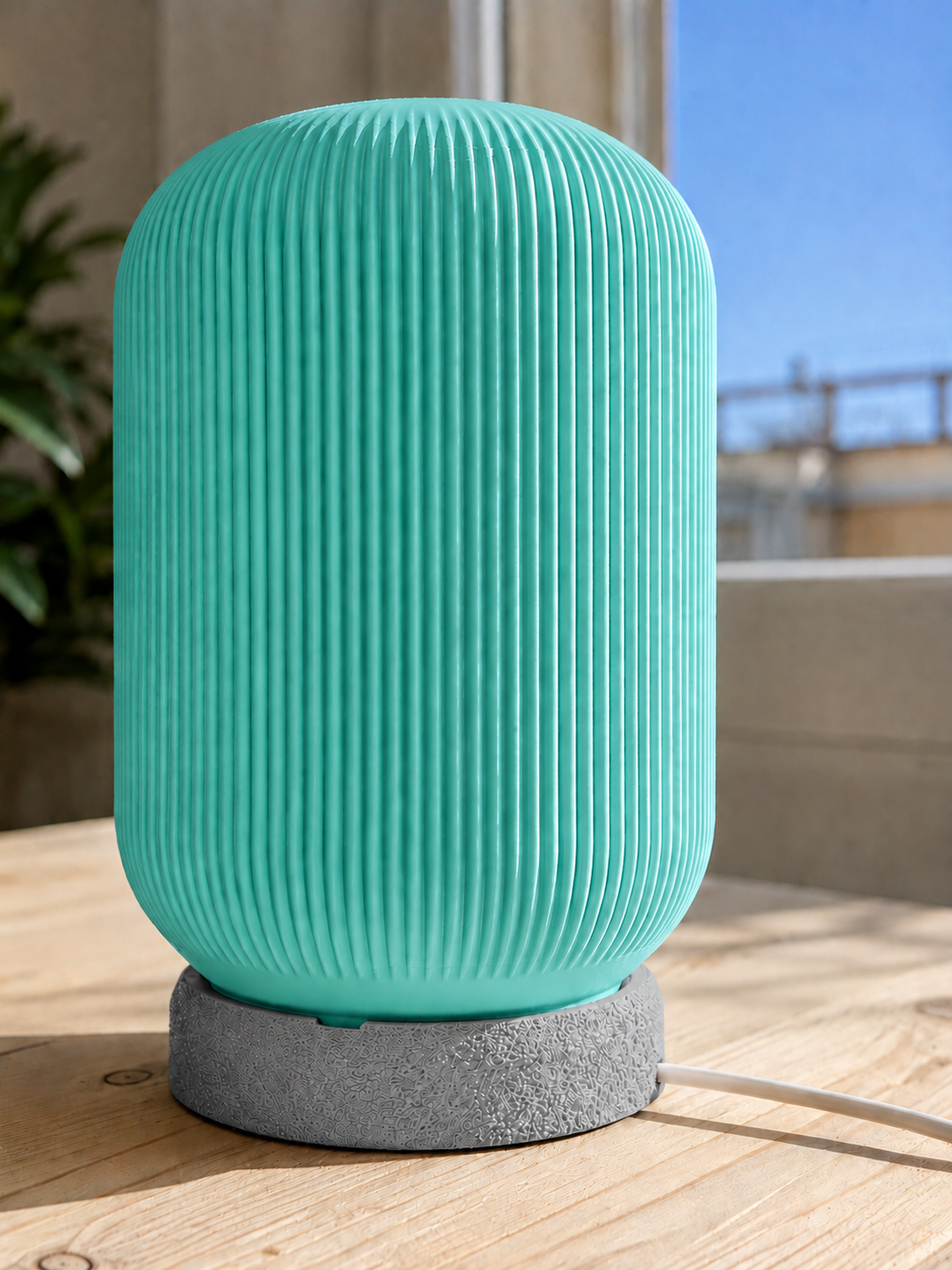 Modern 3D printed table lamp with a turquoise ribbed shade and textured grey base, featuring a contemporary minimalist design for bedrooms, bedside tables, living rooms and modern home decor.