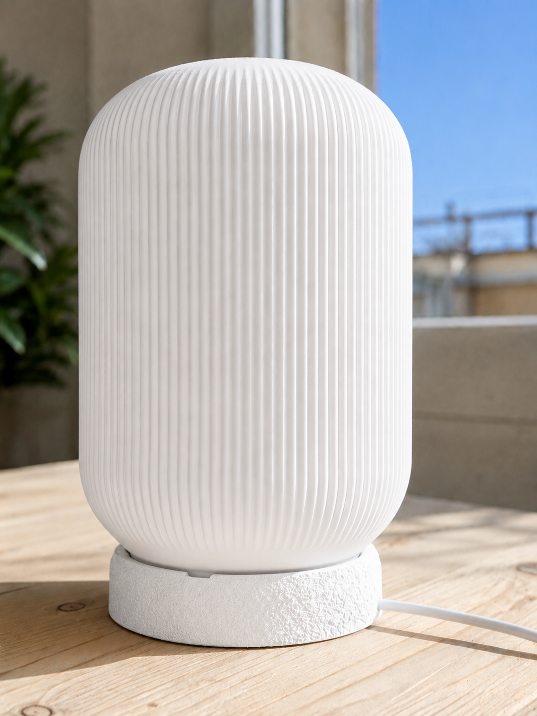 Modern 3D printed table lamp with a white ribbed shade and textured white base, featuring a minimalist contemporary design for bedrooms, bedside tables, living rooms and modern home decor.