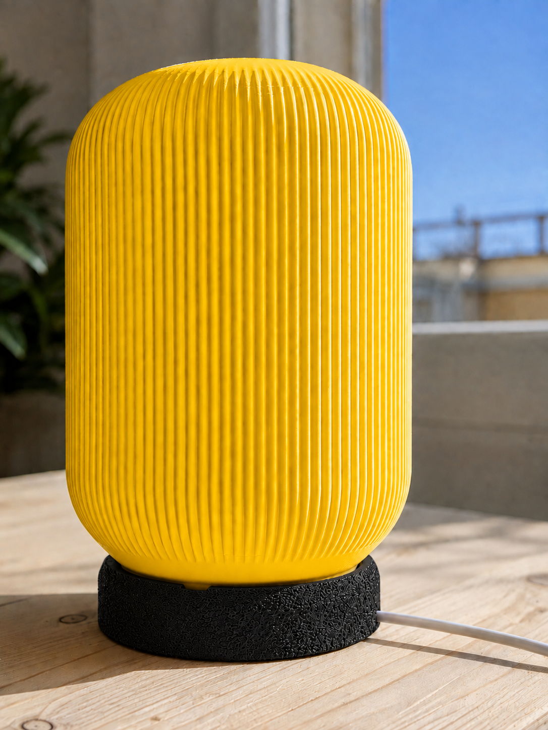 Modern 3D printed table lamp with a vibrant yellow ribbed shade and textured black base, featuring a contemporary minimalist design for bedrooms, bedside tables, living rooms and modern home decor.