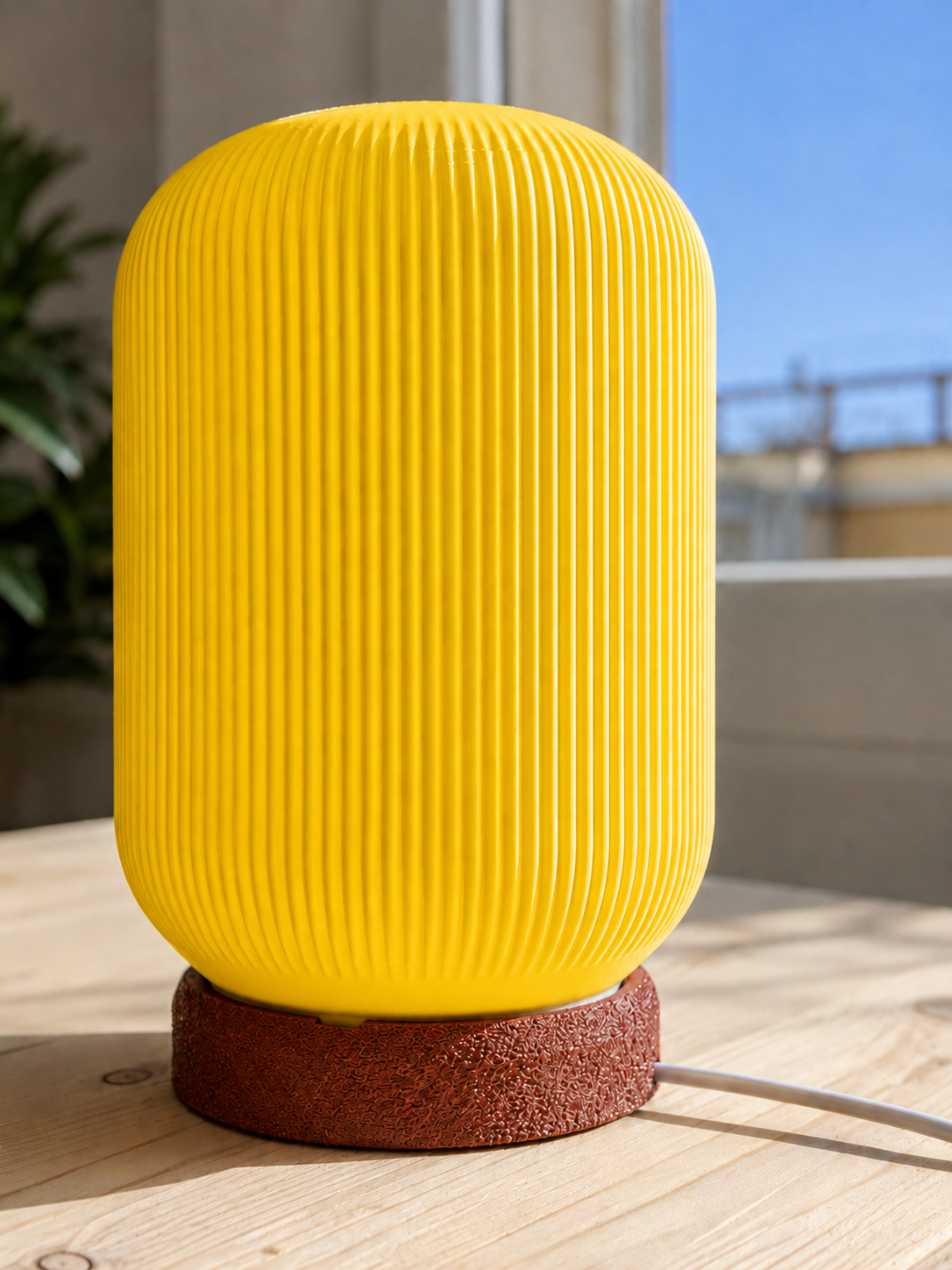 Modern 3D printed table lamp with a vibrant yellow ribbed shade and textured brown base, featuring a contemporary designer style for bedrooms, bedside tables, living rooms and modern home decor.