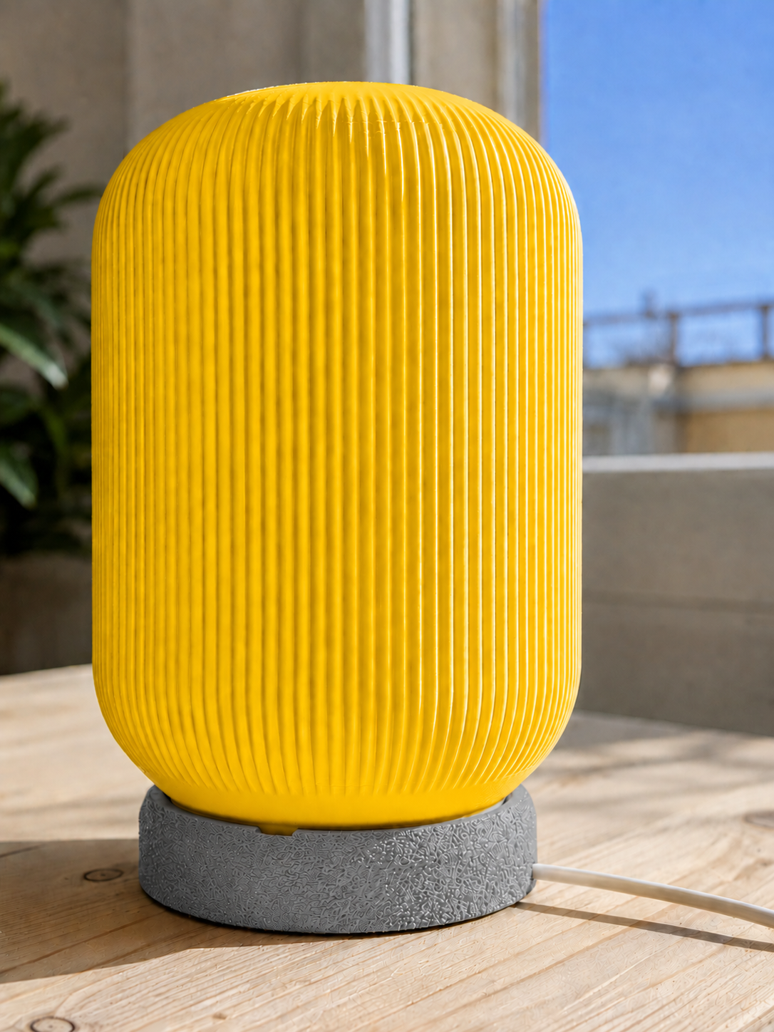 Modern 3D printed table lamp with a vibrant yellow ribbed shade and textured grey base, featuring a contemporary minimalist design for bedrooms, bedside tables, living rooms and modern home decor.