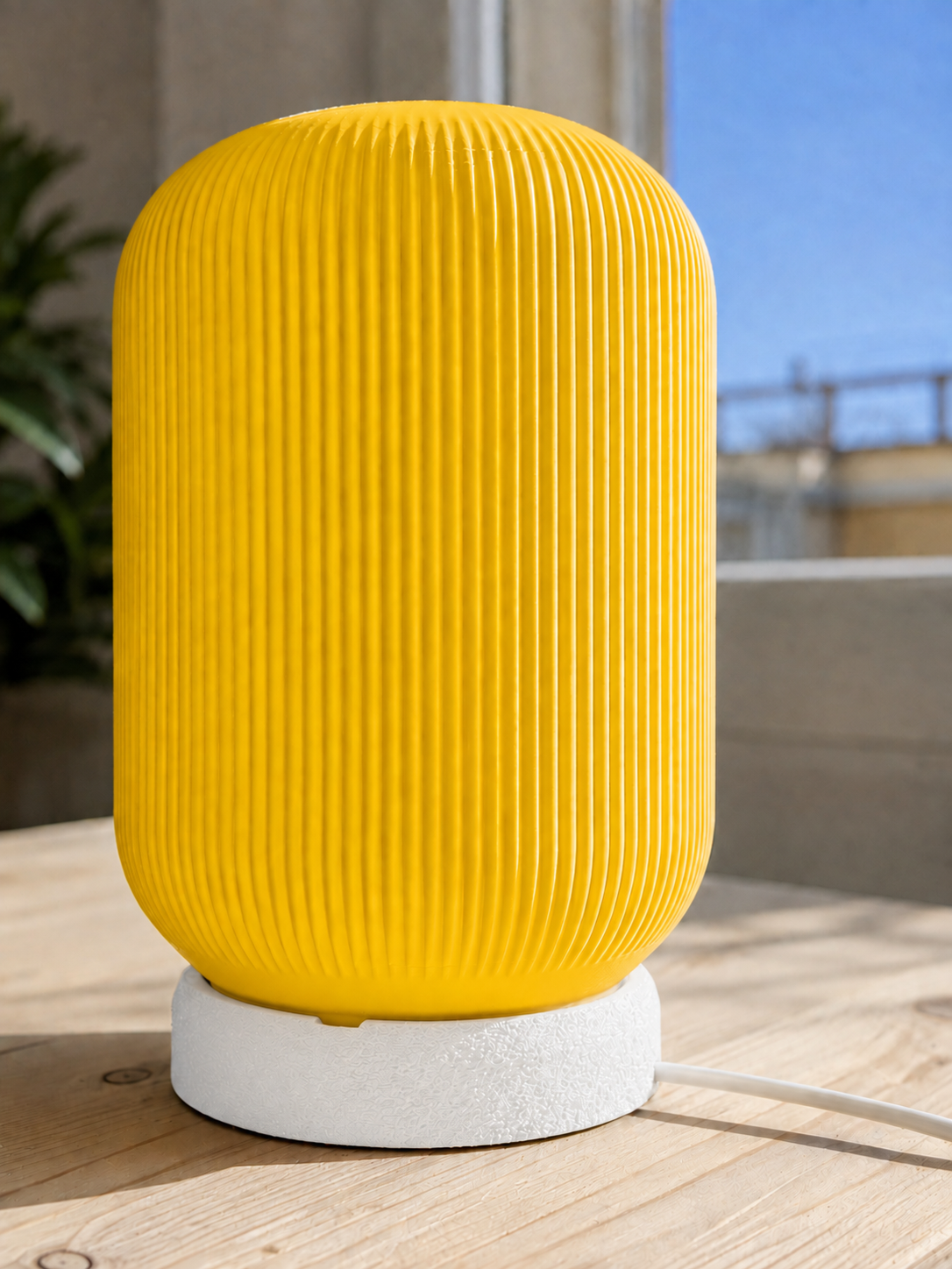 Modern 3D printed table lamp with a vibrant yellow ribbed shade and textured white base, featuring a contemporary minimalist design for bedrooms, bedside tables, living rooms and modern home decor.
