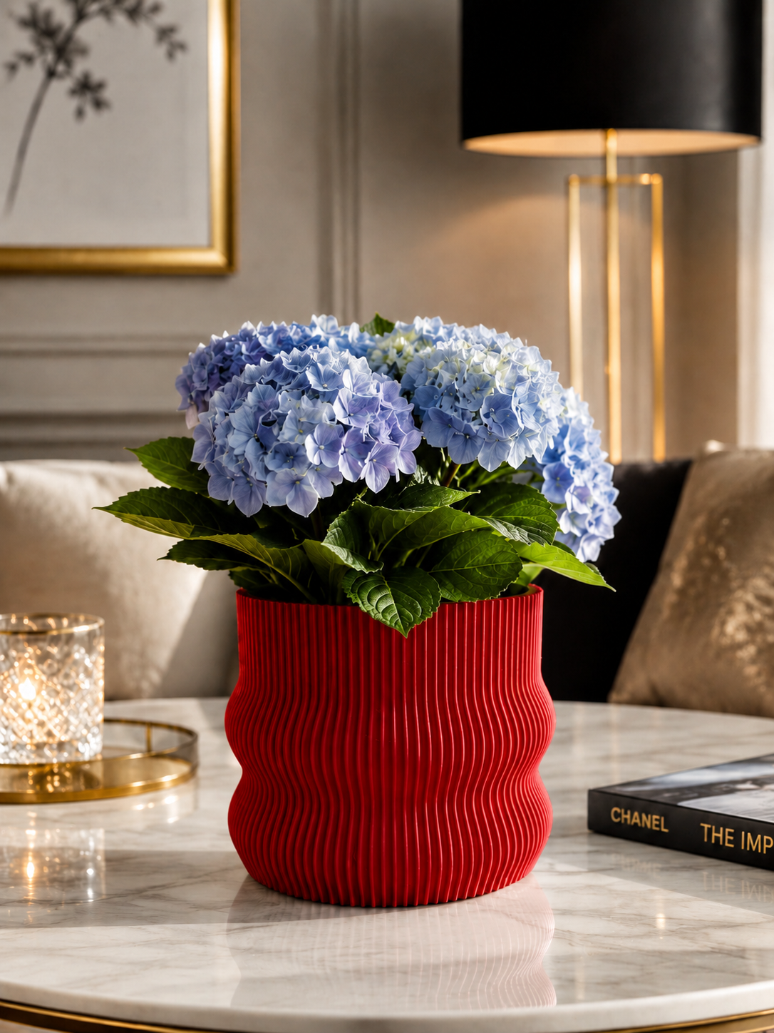 Elegant red 3D printed planter crafted from premium PETG with a sophisticated ribbed design. Decorative indoor plant pot featuring vibrant blue hydrangeas, ideal for luxury home décor, modern living rooms, contemporary interiors, office styling, Scandinavian design and premium decorative spaces. Expertly designed and made in Italy.