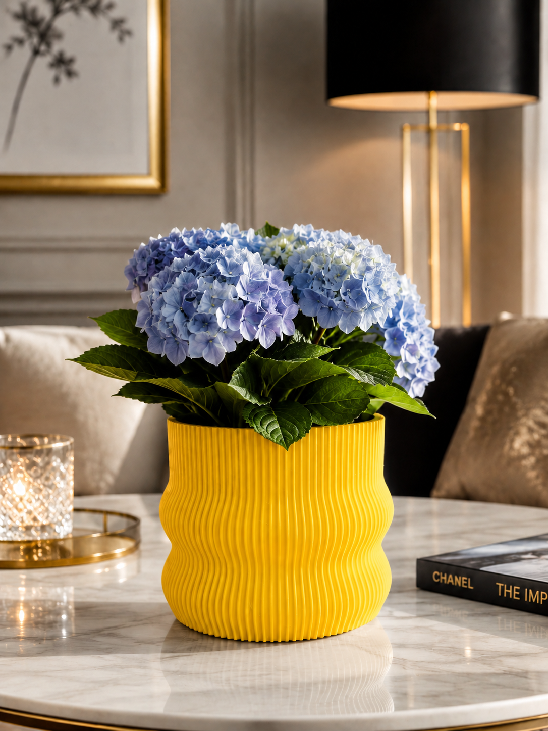 Elegant yellow 3D printed planter crafted from premium PETG with a contemporary ribbed design. Decorative indoor plant pot featuring beautiful blue hydrangeas, perfect for luxury home décor, modern living rooms, Scandinavian interiors, office styling, designer spaces, minimalist home decoration and contemporary interior design. Expertly designed and proudly made in Italy.