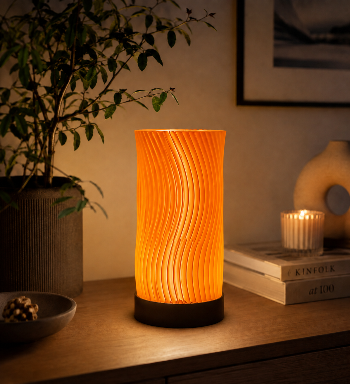 Orange Ocean Waves 3D printed LED table lamp with sculptural wave design, displayed on a wooden table in a modern interior.