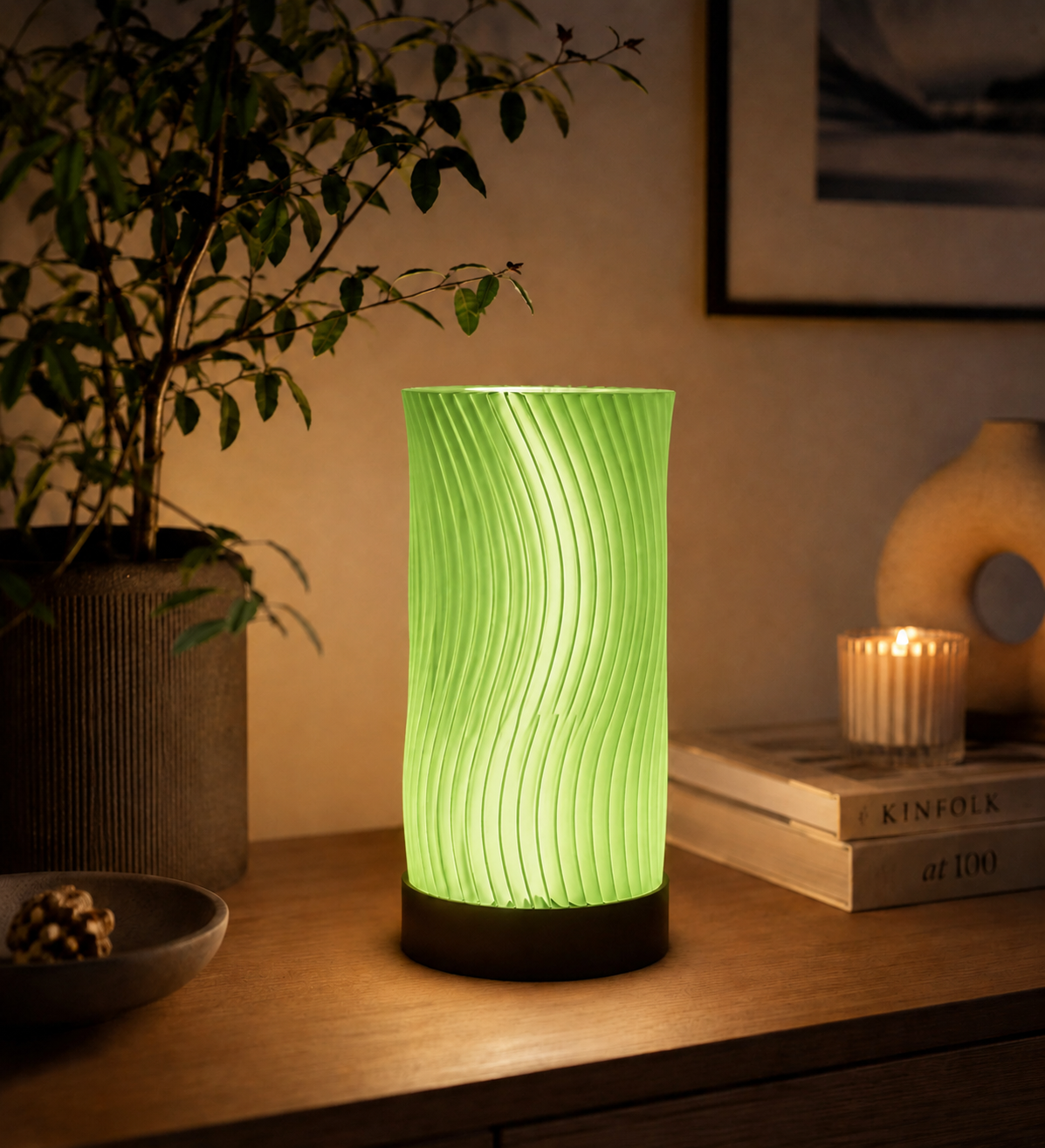 Translucent green Ocean Waves 3D printed LED table lamp with sculptural wave design glowing in a modern interior.