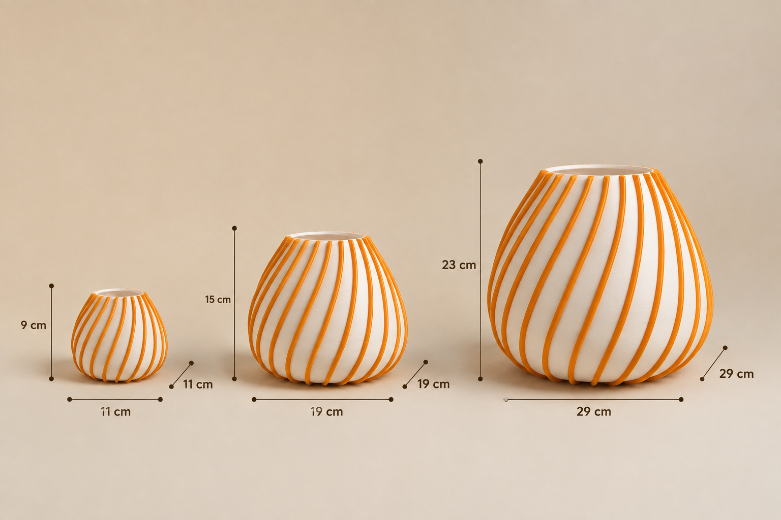 Orange and white striped decorative vase shown in three sizes: small 11 × 11 × 9 cm, medium 19 × 19 × 15 cm and large 29 × 29 × 23 cm.