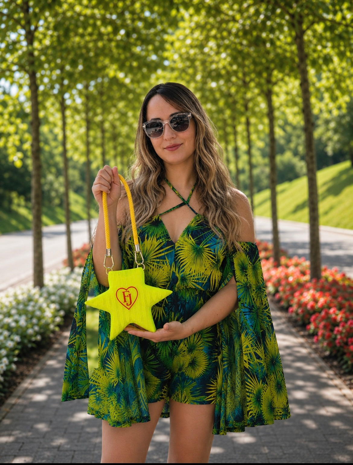 Woman wearing the Stella Cometa fluorescent TPU star handbag during an elegant outdoor walk.