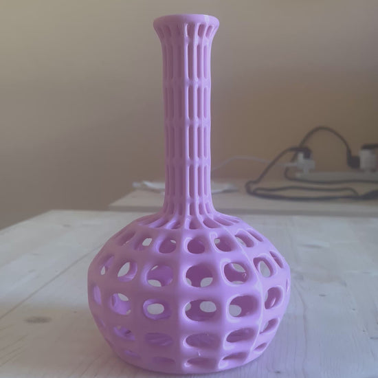Atlantide Pink Designer Vase with flowers displayed on a woman's hand video.