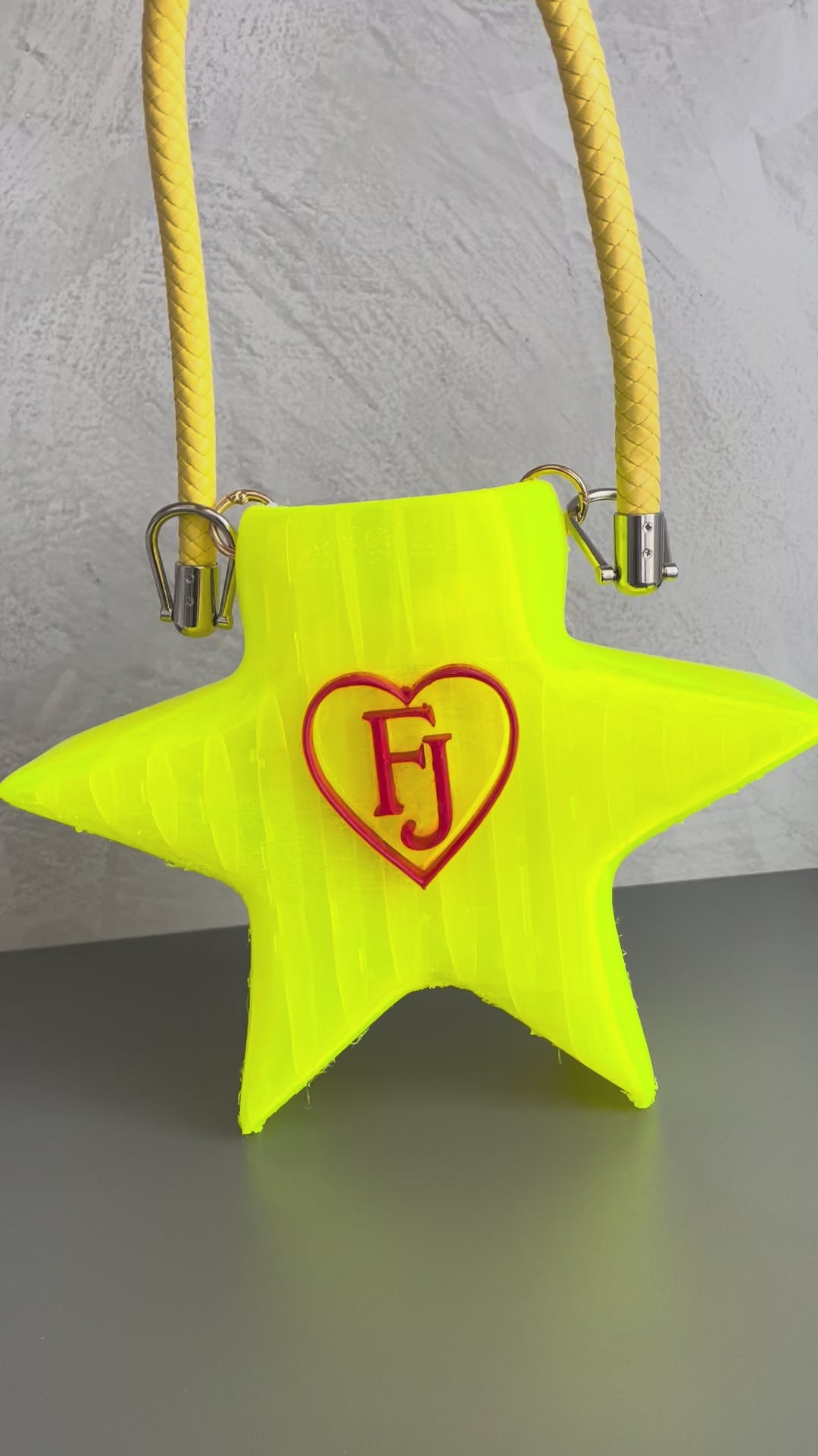 Stella Cometa fluorescent TPU star-shaped handbag photographed outdoors on a tree-lined avenue - demonstration video
